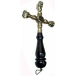 A copper alloy pastry jigger of cruciform baluster design, having a cutting wheel and two prints,