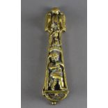 A brass door knocker, cast with putti, 23cm long, impressed to reverse 'A. Kenrick & Sons, No.
