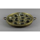 A 19th Century French bronze circular two handled chocolate mould, 21.5cm diameter Some wear and