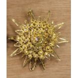 Gold coloured metal star shaped brooch, 5cm diameter, weight 14grams