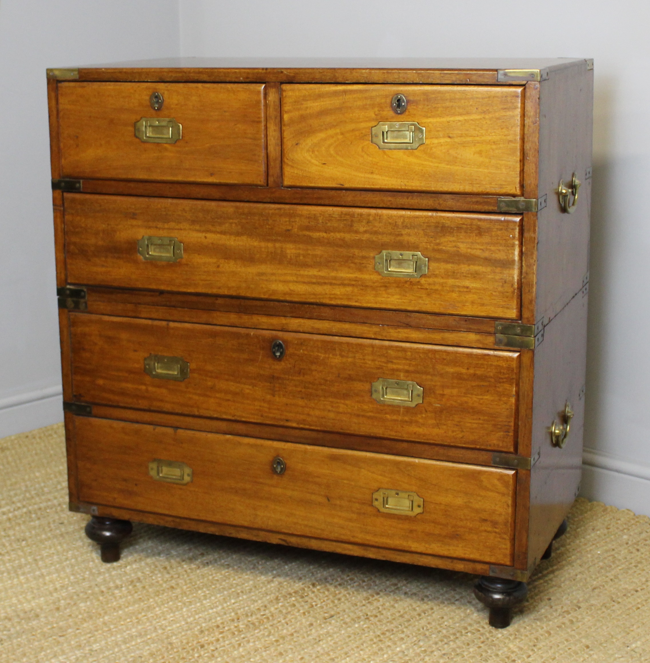 A 19th Century brass bound mahogany Military or Campaign chest, fitted two short and three long