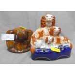 Two Staffordshire Figures one a Group of Spaniels Pen Holder and a Spaniels Head Treacle Glazed