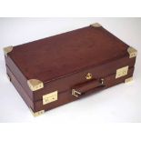 Cartier leather and brass writing case, with crown badge set beside the handle, 13cm high, 42cm wide