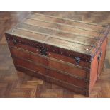 Louis Vuitton steamer trunk, of leather wood and brass stud construction, label to interior, late