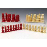 Red and white ivory chess set, 19th century, in the manner of Calvert, all single piece apart from