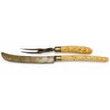 Victorian ivory and steel carving knife and fork both with Burmese handles, the knife in the form of