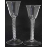 Two wine glasses, with flaring bowls, opaque twist stems, and slightly raised feet, late 18th