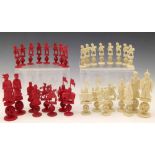 Chinese export red and white ivory figural chess set, 19th century, each of three sections with a