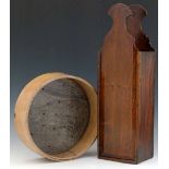 George III ash and elm tinder box, 43cm; and a cheese mould, diameter 24.5cm (2).