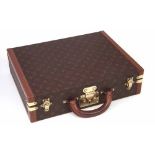 Louis Vuitton attaché case,   with monogrammed canvas cover and leather edges, paper label to