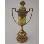 Brass twin handled football trophy cup with detachable lid, 45cm high inscribed "Ano (1923),