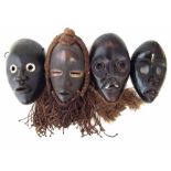 Four Dan masks the largest measures 25.5cm high All lots in this Tribal and African Art Sale are