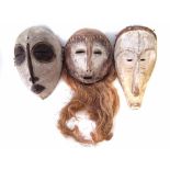 Fang mask, Lega mask, and a Luba mask, the largest measures 34cm high All lots in this Tribal and