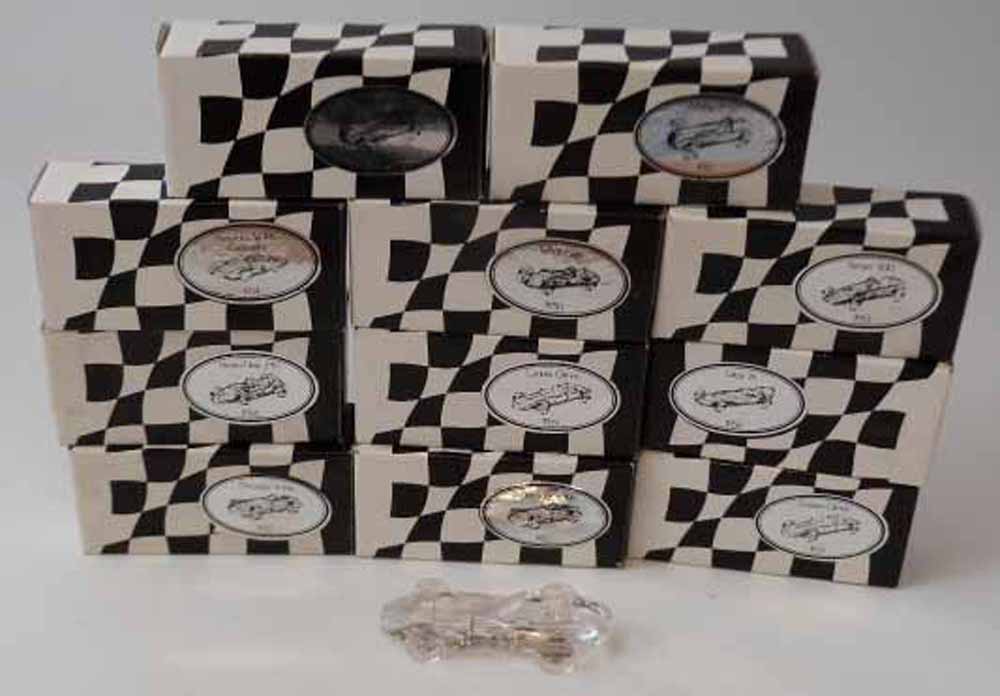 Eleven Atlantis crystal glass car paperweights, all boxed. Condition report: see terms and