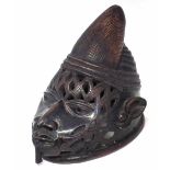 Yoruba helmet mask, 24cm high All lots in this Tribal and African Art Sale are sold subject to V.A.