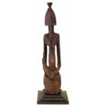 Dogon maternity figure, 89cm high All lots in this Tribal and African Art Sale are sold subject to