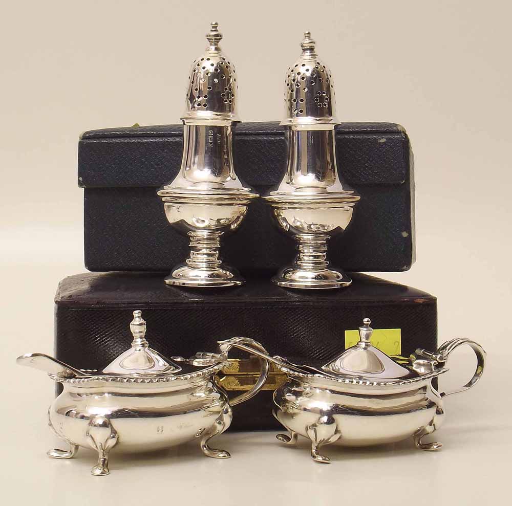 Cased pair of silver mustard pots and a cased pair of silver peppers. Condition report: see terms