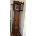 Brass faced longcased clock with two weights and pendulum in an oak case (with key). Condition