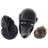 Hemba Monkey mask, another monkey mask and a bird head mask, the largest mask measures 28cm high All