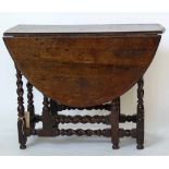 Oak oval gateleg table on barley twist supports, length 124cm.