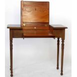 Britisher Patented Writing Table, mahogany, with a hinged and folding top on turned legs, width