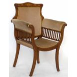 Edwardian inlaid mahogany elbow chair upholstered in beige velvet.