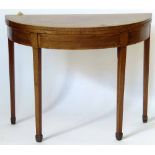 Mahogany demi lune card table with a banded top, width 97cm.