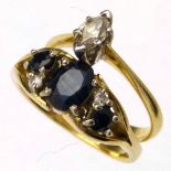 18ct (750) single stone marquise diamond ring and an 18ct gold sapphire and diamond dress ring (2).