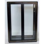 Modern black and gilt glazed display cabinet, width 103cm.