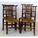 Four spindle back dining chairs with rush seats and earred top rails, 19th century.