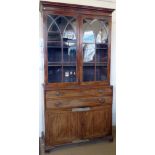 Mahogany secretaire bookcase, early 19th century, the arched glazed doors over a fitted drawer and