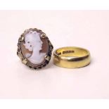 22ct gold wedding ring 7.1g and a cameo ring. Condition report: see terms and conditions