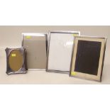 Four silver mounted pictures frames. Condition report: see terms and conditions