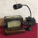 Cast metal rubber stamp stand, Rayner lamp and two tins. Condition report: see terms and conditions