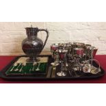 Quantity of plated ware to include 9 plated goblets and a toast rack. Condition report: see terms