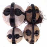 Four Luba masks, the largest measures 30cm high All lots in this Tribal and African Art Sale are