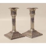 Pair of silver candlesticks, detachable wax pans, acanthus leaf decoration to capitals with square