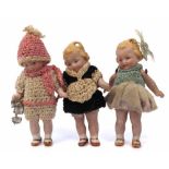 Hertwig bisque Skater doll, together with two other similar dolls, with porcelain jointed legs and