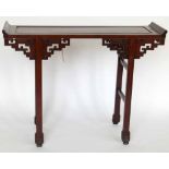 Chinese hardwood altar table with key pattern brackets, length 115cm.