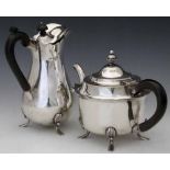 Silver pear-shaped hot water jug with an ebony handle, Elkington, Sheffield 1903, height 21cm; a