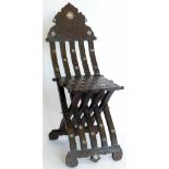 Islamic hardwood folding chair with mother-of-pearl inlay and Arabic calligraphy c.1900.