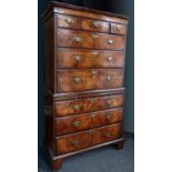 Walnut chest on chest of three short and three long drawers over a slide and three further drawers