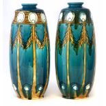 Pair of Minton Secessionist vases, tube lined with swags and stylised motifs on a yellow and