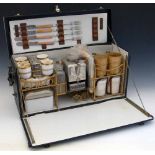 Motor-car picnic set, 1930's, for four people, the black leather cloth cabinet with a fall front