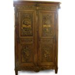 Baroque style walnut armoire of two doors applied with gilt gesso decoration of architectural vistas