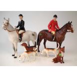 Beswick Hunt set, to include a huntsman on brown horse, huntswoman on grey horse, three hounds and a