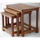 Nest of three Mouseman oak tables by Robert Thompson, outer table 61 x 37cm.