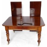 Mahogany wind out dining table on turned legs, width 126cm, closed length 97cm with two extra leaves