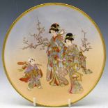 Satsuma dish by Kushida, Meiji period, painted with three figures bearing gifts, artist's