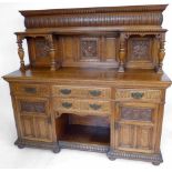 Late Victorian oak sideboard of a panelled back over four drawers and two doors, length 182cm.